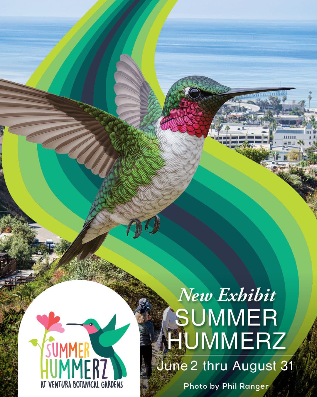 A hummingbird with vibrant green, pink, and white feathers flying over a scenic garden and cityscape.