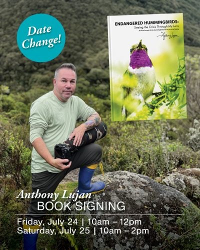 Anthony Lujan at book signing event in Ventura Botanical Gardens with book cover in background.