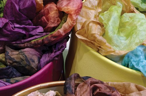 Colorful fabric scraps for dyeing and herbal tea making at Ventura Botanical Gardens.