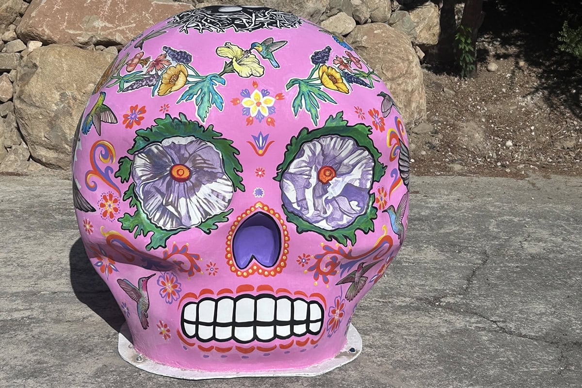 Colorful painted skull sculpture at Ventura Botanical Gardens, Natures Spirits.